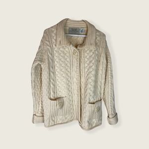 Aran sweater market 100% merino wool made in Ireland.  Has pockets. 3 button top
